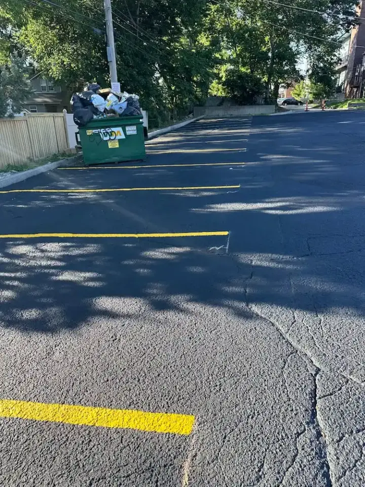 Parking lot asphalt before seal coat after